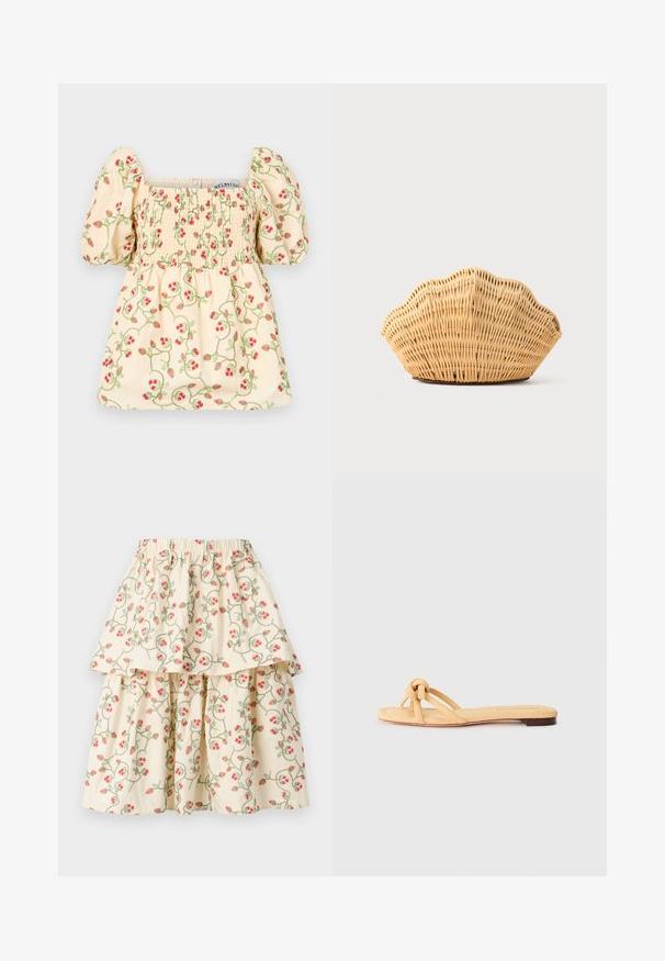 Blusa color crema con mangas abullonadas, que presenta detalles de fruncido y bordados florales de fresas rojas y enredaderas verdes.; Falda de capas color crema con un patrón floral de fresas rojas y enredaderas verdes. Cintura elástica para mayor comodidad y ajuste.; Sandalia plana amarilla tejido con dos tiras cruzadas, un detalle anudado en la parte delantera y una suela baja marrón.; Bolso de mano de ratán tejido con forma de concha de vieira, de color marrón claro natural y bordes redondeados y texturizados.