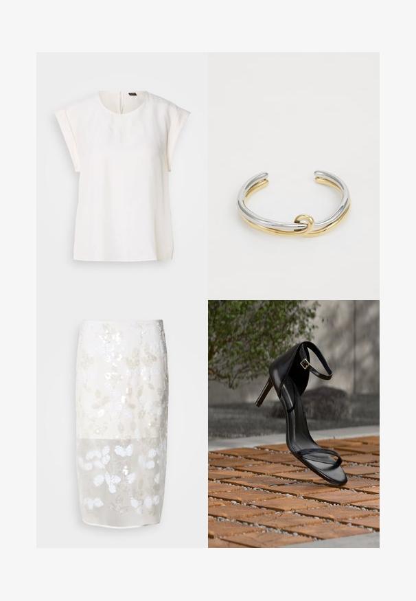 Blusa blanca de manga corta con cuello redondo y corte holgado, con una pequeña etiqueta negra y naranja en la parte trasera del cuello.; Falda hasta la rodilla en crema con un patrón de lentejuelas florales. Capa superior semitransparente, forrada por debajo. Textura suave con varios adornos blancos.; Sandalia negra de tacón alto con correa en el tobillo, parece suspendida sobre un suelo de baldosas de madera al aire libre, con un fondo difuminado de vegetación y piedra.; Pulsera de pulsera de metal que presenta bandas entrelazadas de plata y oro con un acabado suave y pulido. Detalle de nudo notable en el centro.