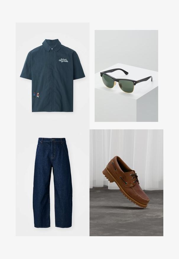 Kortærmet mørkeblå skjorte lavet af bomuldsstof med knap- ned krave. Har hvidt broderet tekst og farverigt pixeliseret par design.; Bredde ben mørk denim jeans med høj talje, som har fem lommer, knaplukning foran og synlige syninger.; Brun læder bådsko med sorte snørebånd, beige syninger og en robust sål, hængende over en grå betongulv.; Ray-Ban solbriller med grønne linser, sorte plastikstel og gyldne detaljer ved kanterne. Firkantet form med mat finish.