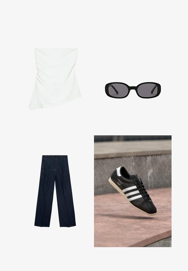 Witte asymmetrische top zonder bandjes met lichte plooidetails aan één kant, aangesloten stijl, strak en minimalistisch ontwerp.; Marineblauwe wijde jeans met een hoge taille, plooien en een traditionele vijf-pocketdesign, gemaakt van denim stof met subtiele stiksels.; Zwarte leren sneaker met witte strepen en zool, veters gestrikt, zwevend boven een rozeachtig betonnen oppervlak met een grijze stenen muur op de achtergrond.; Zwarte ovale zonnebril met dikke monturen en donkere glazen getoond op een effen witte achtergrond.