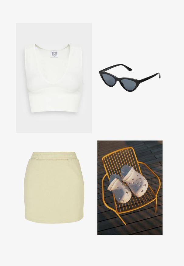 Crop top blanc côtelé avec un décolleté en V profond et de larges bretelles. Étiquette visible avec le nom de la marque "BDG" et la taille "S." Texture lisse.; Jupe jaune clair en tissu doux, dotée d'une taille élastique et d'une coupe droite. Texture lisse sans motifs ni accents visibles.; Des sabots Crocs blancs présentent un design perforé, des semelles plates et des sangles de talon réglables, reposant sur une chaise en fil jaune contre un sol en bois.; Lunettes de soleil noires en forme d'œil de chat avec des verres gris foncé, monture en plastique élégante, coins pointus et branches droites. Pas de métal visible ni d'accents.