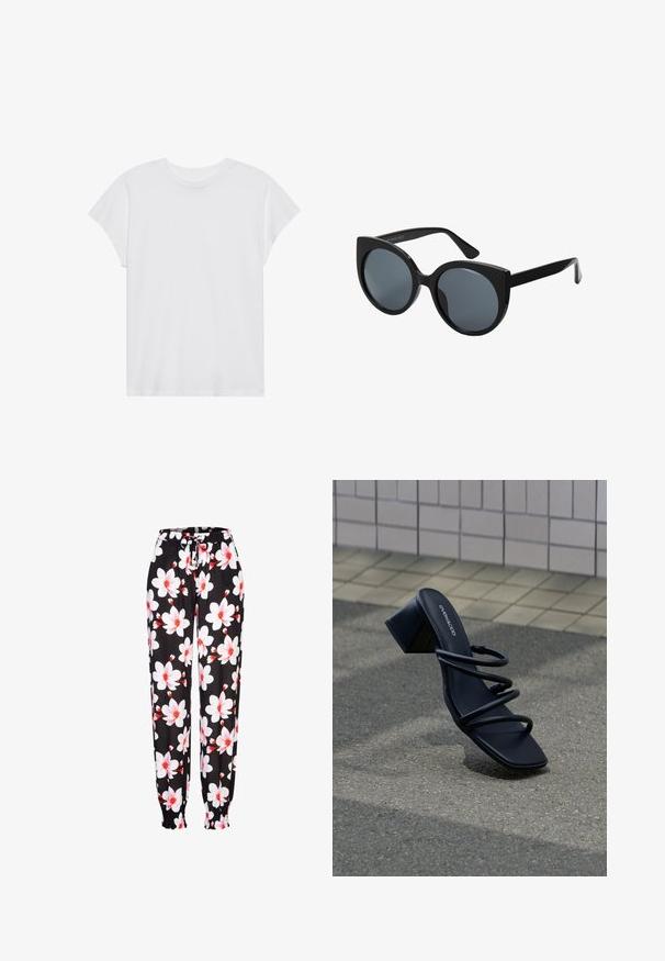 T-shirt blanc à manches courtes, col rond, coupe décontractée, en tissu de coton doux. Texture lisse, sans motifs ni logos.; Pantalons en tissu noir avec un motif floral blanc et rouge, taille élastique avec cordon de serrage, et poignets froncés. Matière légère.; Sandale noire à bout carré, trois fines brides et talon bloc sur un trottoir près d'un mur carrelé.; Lunettes de soleil oversize noires en forme d'œil de chat, avec des verres teintés foncés et une monture en plastique brillant. Caractéristiques de branches épaisses pour le soutien.