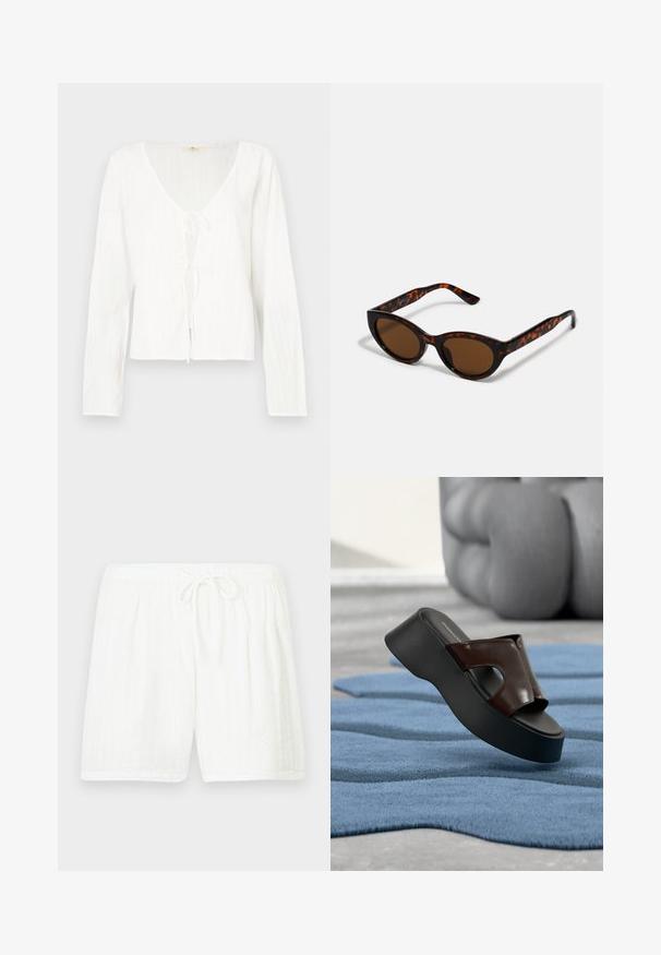 Blouse blanche à manches longues avec un col en V profond, un nœud à l'avant et des rayures texturées sur tout le tissu.; Shorts blancs en coton avec une taille élastique et un cordon de serrage. Présentent un motif texturé avec des rayures verticales et des poches latérales.; Sandale plateforme noire avec dessus en cuir marron foncé et détail ajouré, posée sur un tapis bleu texturé, avec une chaise sculpturale en arrière-plan.; Lunettes de soleil en écaille de tortue marron avec une forme vintage de lunettes cat-eye et des verres marron. Présente des branches courbées avec des accents rouges.