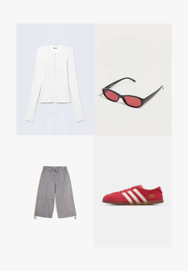 Chemise Henley blanche à manches longues avec col rond et une rangée verticale de petits boutons au centre devant.; Pantalon gris à jambes larges coupé-courte avec poches plaquées à l’avant, taille à cordon et liens ajustables à l’ourlet.; Baskets en daim rouge avec un design à trois rayures blanches, semelle plate et détail logo doré. Design bas avec bout arrondi et fermeture à lacets.; Lunettes de soleil ovales noires avec des branches fines et des verres teintés rouges posées sur une surface blanche.