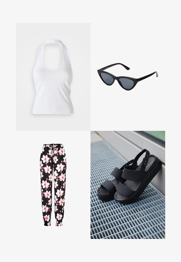 Haut halter blanc avec un décolleté en forme de cœur, fabriqué en tissu lisse et extensible. Présente un design minimaliste sans embellissements ni motifs.; Pantalons en tissu noir avec un motif floral blanc et rouge, taille élastique avec cordon de serrage, et poignets froncés. Matière légère.; Sandales à plateforme noires avec deux larges brides et une bride arrière, posées sur une surface métallique grillagée à côté d'une fenêtre en verre.; Lunettes de soleil noires en forme d'œil de chat avec des verres gris foncé, monture en plastique élégante, coins pointus et branches droites. Pas de métal visible ni d'accents.