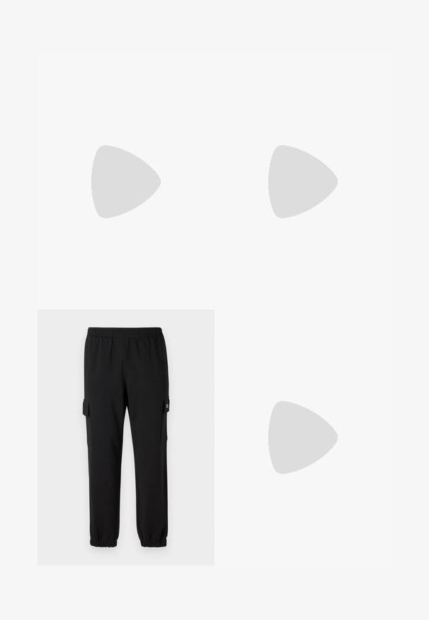 T-shirt en coton blanc avec col rond et manches courtes. Présente un petit logo lacoste noir sur le côté gauche de la poitrine.; Pantalons de jogging noirs avec une ceinture élastique, des poignets fuselés et des poches cargo latérales. Fabriqué en matériau doux avec une texture lisse.; Baskets basses blanches avec un design à lacets et un logo crocodile en relief, positionnées au-dessus d'un sol gris poli avec un mur en blocs de verre en arrière-plan.; Sac à épaule noir Lacoste avec forme incurvée, bandoulière réglable et logo crocodile blanc embossé au-dessus du nom de la marque à l'avant.