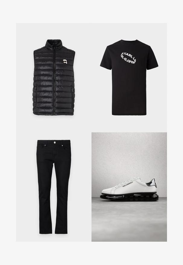 Gilet rembourré noir avec col montant, fermeture zip sur le devant, deux poches latérales et un petit logo sur la poitrine. Matière lisse et légère.; T-shirt en coton noir à manches courtes et col rond. Présente un texte de logo blanc distordu imprimé sur le devant.; Jeans en denim noir à coupe slim, design à jambe droite, style cinq poches, et fermeture à bouton en métal, avec des détails de couture minimalistes.; Baskets en cuir blanc avec semelle en caoutchouc noir et détails transparents. Elles sont dotées de lacets et d'un logo embossé, posées sur un sol gris.