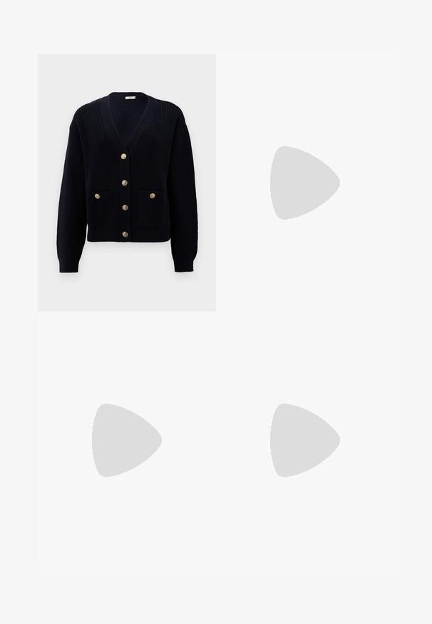 Navy ribbed cardigan with a V-neck, featuring six gold buttons and two front pockets. Soft texture and fitted cuffs complete the design.; White long-sleeve turtleneck top made of smooth, stretchy fabric. Features a high collar and fitted design, with no visible patterns or embellishments.; Light blue wide-leg jeans made from denim, featuring a high waist, five-pocket design, and subtle fading for a worn-in look.; White platform sneakers made of smooth synthetic material, featuring a rounded toe, lace-up design, and a textured rubber sole. Black heel accent.