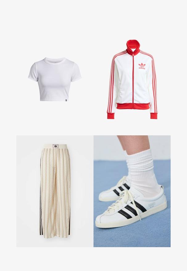 Witte sportjack met rode accenten, volledige rits, hoge kraag, drie rode strepen op de mouwen en geborduurd rood Adidas-logo op de borst.; Witte geribbelde korte mouwen cropped t-shirt met ronde hals en een klein zwart logo label aan de onderrand.; Crème kleurige wijde broek met een zigzagpatroon, met een zwarte logo tailleband en zij zwarte strepen. Lichtgewicht, gestructureerde stof.; Witte leren sneakers met zwarte strepen, crèmekleurige zool en lichtkleurige veters. Draag met witte geribbelde sokken, gepositioneerd op een blauwe achtergrond.