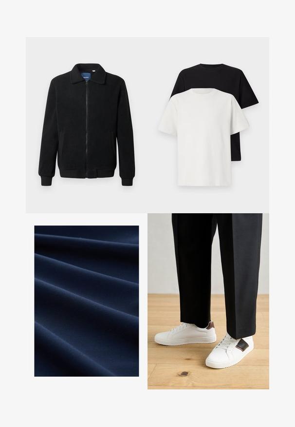 Fekete bolyhos dzseki cipzárral, állógallérral, bordázott mandzsettákkal és oldalzsebekkel, textúrált felülettel.; Pamut póló szett, amely egy fekete és egy fehér pólót tartalmaz, mindkettő rövid ujjú, környakú és normál fazonú. Texturált anyag.; Sötétkék szövet sima textúrával, átlós redőkkel, amelyek mélységet és dimenziót kölcsönöznek a redőzésnek.; Fehér sneaker, sima textúrával, barna bőr díszítéssel és fekete részletekkel, fekete szabott nadrággal párosítva. Fából készült padló háttér.