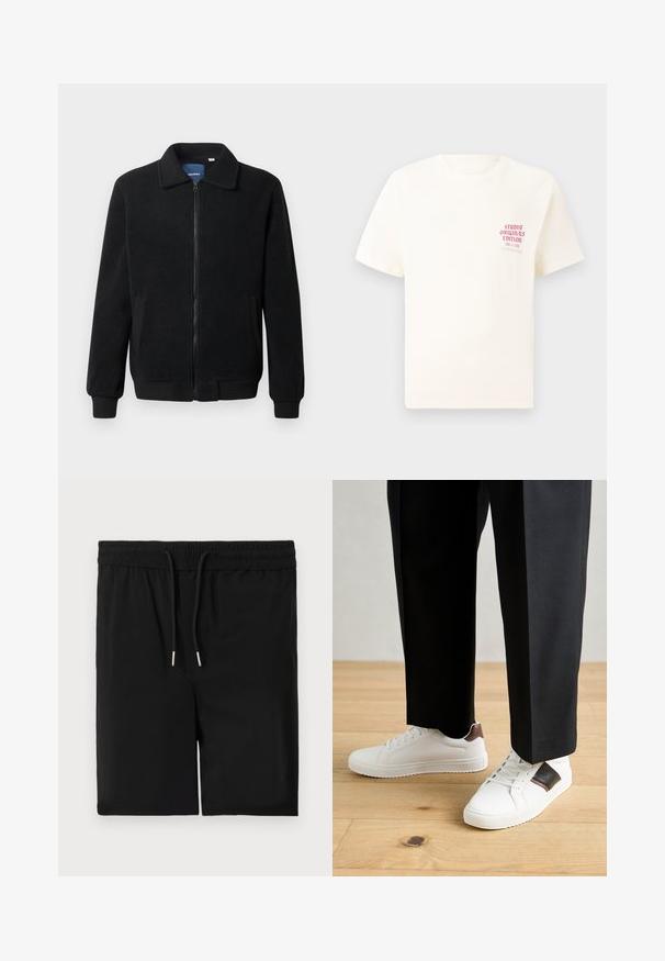 Fekete bolyhos dzseki cipzárral, állógallérral, bordázott mandzsettákkal és oldalzsebekkel, textúrált felülettel.; Fehér, rövid ujjú póló, bal mellen piros szöveggel "Studio Originals Edition", semleges szürke háttér előtt.; Fekete, puha anyagból készült rövidnadrág, rugalmas derekú zsinórral, sima textúrával. Zsebek vagy egyéb díszítések nélkül.; Fehér sneaker, sima textúrával, barna bőr díszítéssel és fekete részletekkel, fekete szabott nadrággal párosítva. Fából készült padló háttér.