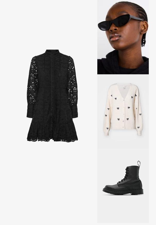 YAS EMBROIDED - Kardigán - birch; Fekete hímzett ruha magas gallérral, gombos elülsőrészsel, hosszú ujjakkal és fodros szegéllyel. Kivágott virágos és geometrikus mintákkal díszített.; Fekete bőr harci csizma, kerek orral, fűzős elülső résszel és húzófüllel a bokánál. Vastag gumitalp jellemzi, amely tartósságot biztosít.; Fekete macska szemüveg napszemüveg, matt felülettel, amely karcsú formájával és finoman ívelt széleivel tűnik ki, egy modell sötét ruhái háttérben.