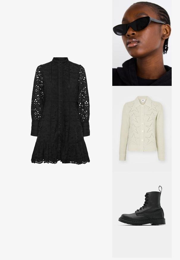 Beige kötött kardigán, galléros nyakkal, gombos elülső résszel és csillag motívumú kivágásokkal. A bordázott mandzsetták és az alj textúráját fokozzák.; Fekete hímzett ruha magas gallérral, gombos elülsőrészsel, hosszú ujjakkal és fodros szegéllyel. Kivágott virágos és geometrikus mintákkal díszített.; Fekete bőr harci csizma, kerek orral, fűzős elülső résszel és húzófüllel a bokánál. Vastag gumitalp jellemzi, amely tartósságot biztosít.; Fekete macska szemüveg napszemüveg, matt felülettel, amely karcsú formájával és finoman ívelt széleivel tűnik ki, egy modell sötét ruhái háttérben.