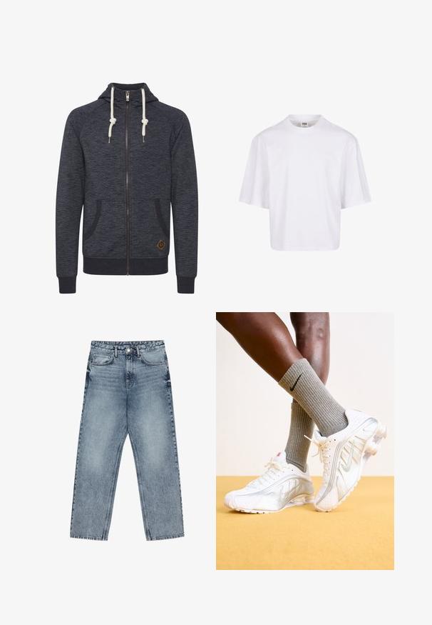 Donkergrijze zip-up hoodie met een gestructureerde afwerking, voorzien van een capuchon met trekkoord, twee zijzakken en een klein bruin logo-embleem aan de onderrand.; Witte, kortekorte t-shirt met een ronde hals en een ontspannen pasvorm, gemaakt van een zachte katoenmix. Geen patronen of versieringen.; Lichtblauwe denim jeans met een rechte pijp, zichtbare stiksels, vijf zakken en een knoopsluiting in de taille.; Nike sneakers in het wit met zilveren accenten, met textuurpanelen en perforaties. Gecombineerd met grijze geribde sokken, tegen een gele achtergrond.