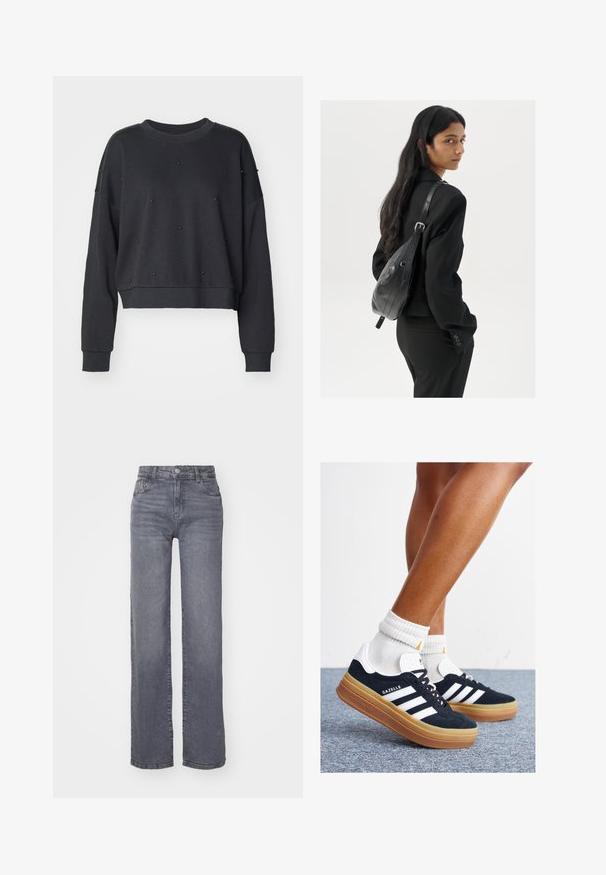 Mørk grå forkortet genser laget av mykt stoff, med rund halsutskjæring og dekorert med små svarte nagle detaljer.; Sett med tre kortermede t-skjorter i svart, grått og hvitt. Laget av bomull, med rund hals og en enkel, ensfarget design.; Grå vide ben jeans laget av denim med en glatt tekstur, med en knapp- og glidelås-lukking, og fem lommer.; Svarte sneakers i semsket skinn med hvite striper og detaljer, rund tå, yttersåle i gummigummi, kombinert med hvite ribbestrikkede crew-sokker.; Kvinne med langt mørkt hår iført et svart jakkesett, som bærer en svart skinn skulderveske, og ser over skulderen mot en hvit bakgrunn.