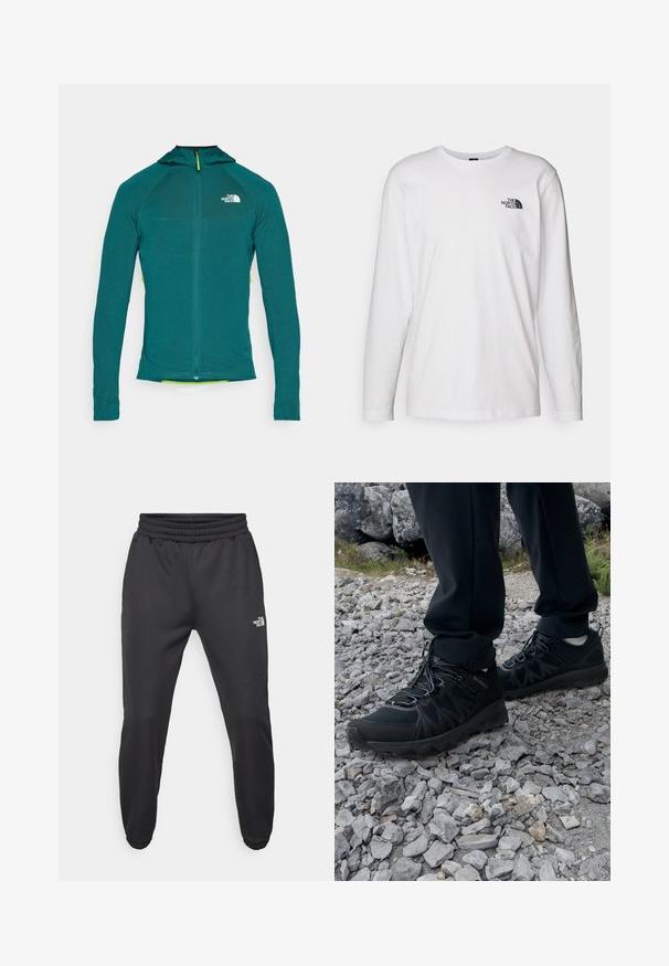 Kapturowana kurtka z długim rękawem w kolorze teal, z suwakiem na ćwierć długości, teksturowanym materiałem i kontrastowym żółtym uchwytem suwaka.; Biała koszulka z długim rękawem wykonana z bawełny, z okrągłym dekoltem. Posiada małe czarne logo na piersi. Gładka faktura, regularny krój.; Czarne dresy z elastycznym paskiem w talii, zwężanym krojem, elastycznymi mankietami i małym białym logo na lewej udzie, wykonane z gładkiego materiału.; Czarne buty outdoorowe wykonane z siateczki i materiału syntetycznego, z fakturowaną cholewką, zabezpieczonym systemem sznurowania i solidną podeszwą, na skalistym terenie.