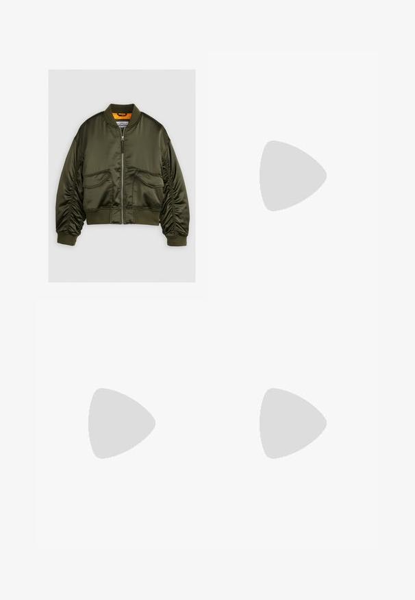 Olive green bomber jacket made from satin fabric, featuring a zip-up front, ribbed cuffs, and two front pockets. Accented with an orange lining.; White sleeveless top made of smooth, stretchy fabric with gathered details along the sides, featuring a round neckline and a fitted silhouette.; Dark blue denim flared jeans with a classic five-pocket design, standard button closure, and minimal stitching accents on the pockets.; White leather sneaker with beige suede accents, perforated toe box, flat laces, and a textured cream sole. Features subtle branding on heel.