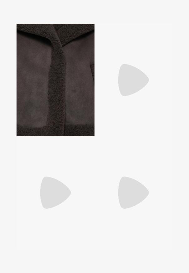 Brown jacket featuring a textured, fuzzy collar and smooth fabric. The design includes a central opening and minimalist aesthetic.; White T-shirt featuring a popcorn graphic in red and pearl accents, with the text "ATTITUDE" below. Short sleeves and a classic fit.; Wide-leg denim trousers featuring a light to dark blue gradient, high waist, belt loops, and a matching fabric belt. Textured denim finish.; Navy blue sneaker with a textured fabric upper, white platform sole, rounded toe, and black heel accent. Features six eyelets for laces.