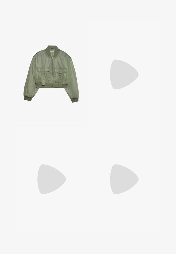 Veste bomber verte olive raccourcie en nylon brillant avec des poignets côtelés, deux poches avant et des accents en anneau argenté. Fermeture zippée à l'avant.; Top noir sans manches avec un col en V, présentant des détails en dentelle au niveau de l'encolure et un design distinctif à ourlet évasé. Fabriqué en tissu doux et lisse.; Jupe noire avec un motif floral vert, dotée de bords à volants et de plis. Fabriquée en tissu léger, offrant une silhouette fluide.; Chaussure à talons hauts en cuir verni noir avec un bout pointu, détail de sangle décorative à l'avant et un fin talon aiguille.