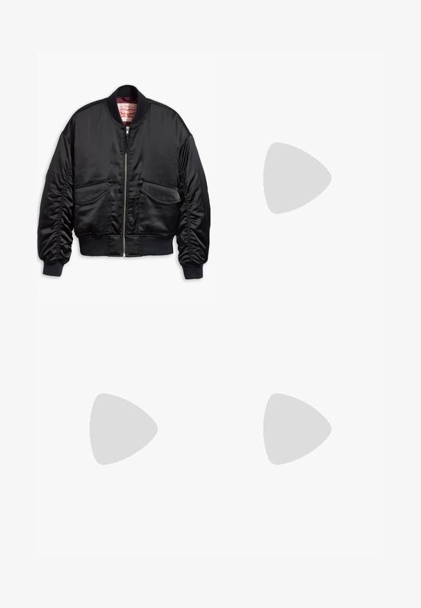 Black bomber jacket made of smooth satin with a cropped design, featuring ribbed cuffs and hem, two front pockets, and a zip closure.; Black cropped t-shirt made of cotton, featuring a round neckline and short sleeves. Includes a patch pocket with a "REPLAY" label.; Black leather low-rise shorts with decorative metal buttons on front and sides, featuring front pockets and stitching details.; Black leather mid-calf boot with two buckles near the top and a strap with metal ring detail around the ankle on a white background.