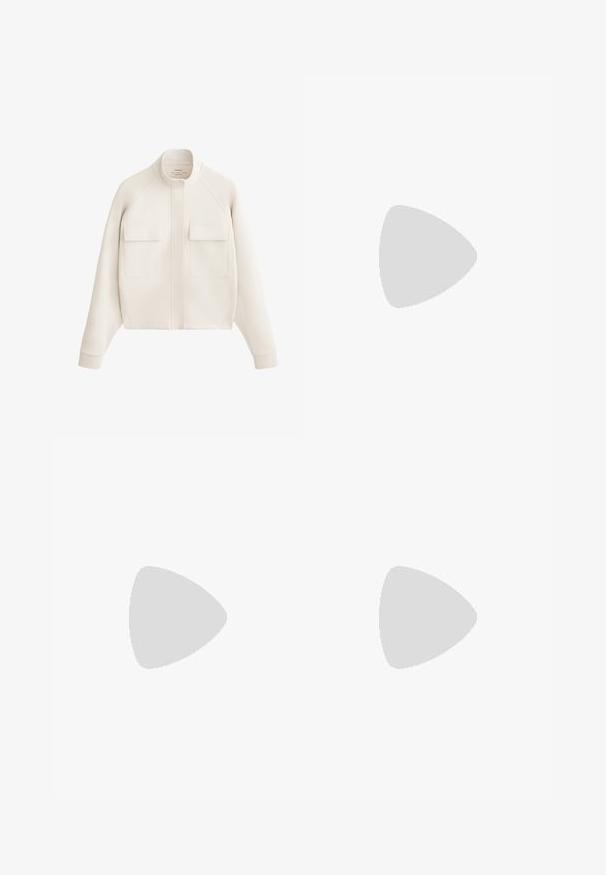 Jachetă alb-crem dintr-un material moale, cu guler înalt, două buzunare frontale și mansete ribbed pentru o siluetă modernă, structurat.; Top sportiv alb, scurt, cu guler înalt și două bretele încrucișate la spate, realizat dintr-un material neted și elastic.; Pantaloni largi, maro, cu nervuri, având o textură netedă și un brâu ajustat. Design fără cusături, fără hardware sau embellishments vizibile.; Pantofii sport albi cu partea superioară din plasă, guler căptușit și detalii texturate; prezintă talpa Cloudtec cu orificii de ventilație pentru respirabilitate.