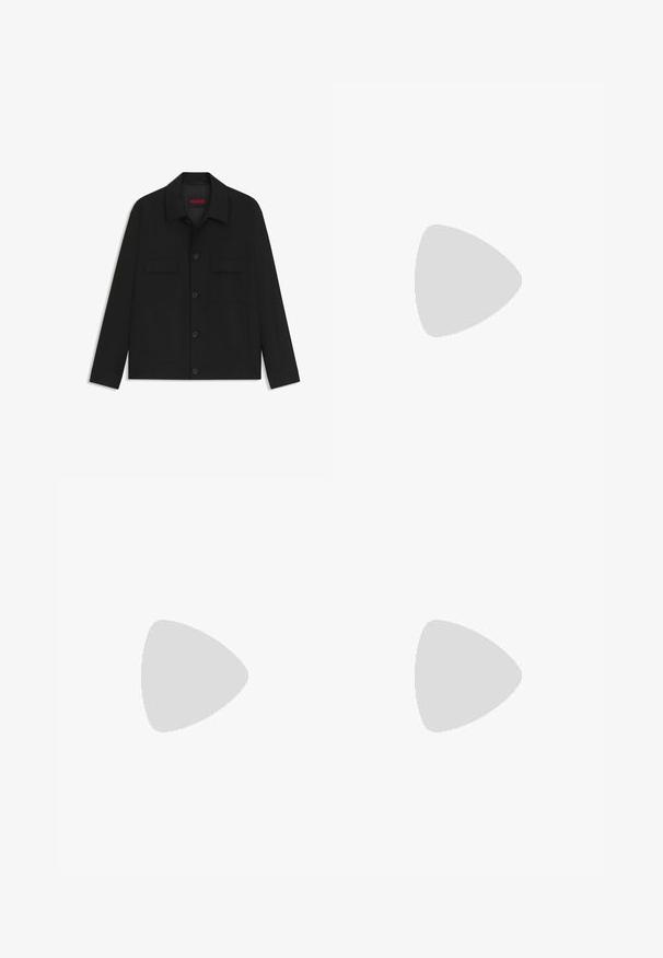 Black jacket featuring a button-up front, two chest pockets, and a collared neck. Made from smooth fabric with a structured design.; Two black cotton T-shirts with round necklines, short sleeves, and blue "HUGO" labels on the collars and side hems.; Black wide-leg trousers with a flat front, two side pockets, pleated design, and a contrasting red interior waistband.; Black slip-on shoes with textured leather uppers and a gray rubber outsole, set against a wooden floor and corduroy pants.
