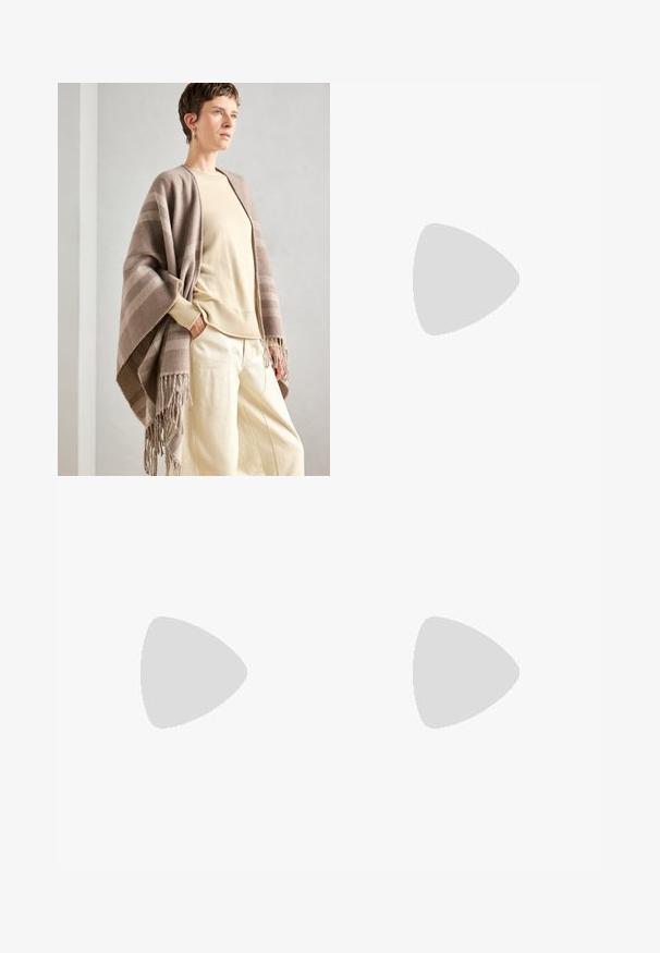 Brown striped shawl made of soft fabric, featuring fringed edges. Paired with a light cream sweater and loose cream trousers.; White sleeveless bodysuit with a high neckline and a thong cut. Smooth texture and fitted silhouette designed for a form-fitting look.; Black flared jeans made of denim, featuring a front button closure, five pockets, and a smooth, slightly shiny texture.; White pointed-toe slingback heels with a thin ankle strap. Smooth leather material, thin stiletto heel, and a black interior lining.