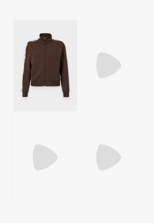 Brown zip-up jacket in soft fabric, featuring a high collar, side pockets, and patterned accents along the shoulders. Ribbed cuffs and hem.; White cotton t-shirt with short sleeves and a round neckline. Features a black Adidas logo on the chest and a contrasting black inner collar.; Light blue wide-leg trousers with a smooth cotton blend fabric, featuring front pockets and a button closure at the waist.; White sneaker with green accents, three stripes, floral embroidery, and a gum sole. Features a rounded toe and lace-up design.
