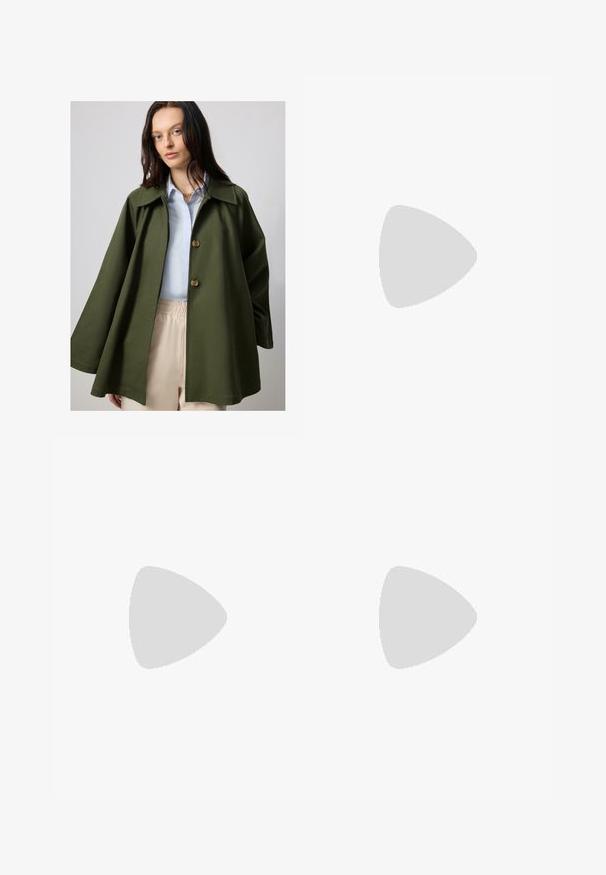 Olive green, oversized jacket with a wide collar and two large buttons, paired with a light blue shirt. Lightweight fabric, smooth texture.; White short-sleeve t-shirt made of cotton. Features a crew neck and a small black Adidas logo on the chest. Straight-cut hem.; Light blue wide-leg jeans made from denim. Features a high waist, five pockets, and a straight cut with minimal fading.; Sport shoes with a white leather upper, gray suede toe, and three black stripes. Features a blue logo on the tongue and a textured rubber sole.