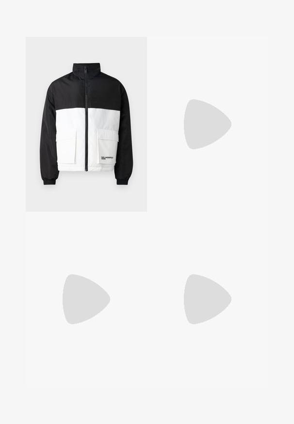 Color-blocked jacket with a black upper section and white lower section. Features a high collar, front zipper, and two front pockets.; Black cotton t-shirt with a round neckline and short sleeves. Features a loose fit and a simple design without patterns or accents.; Black wide-leg trousers with a flat front, two side pockets, pleated design, and a contrasting red interior waistband.; Black leather sneaker with textured upper, padded collar, and red logo detail. Features a thick rubber sole with distinct tread pattern.