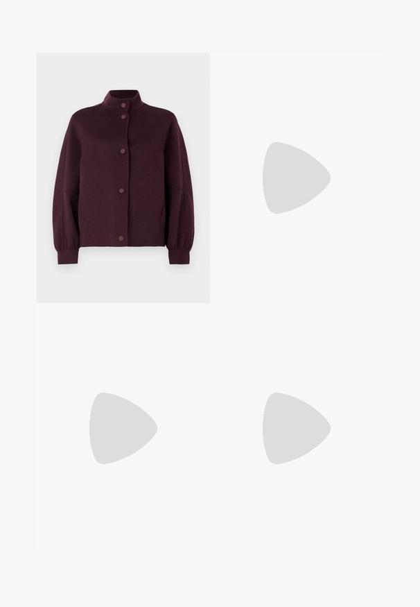 Dark purple button-up wool jacket with high collar, long slightly puffed sleeves, and fitted cuffs on a white background.; White sweater in plush fabric featuring a black "Saints" graphic on the front. Round neck, long sleeves, and ribbed hem detailing.; Black leather pants with a straight fit, high waistband, zip closure, and visible stitching details along the seams. Smooth texture.; Black leather ankle boot with a pointed toe, high block heel, and silver toe cap detail. Smooth texture and simple design.