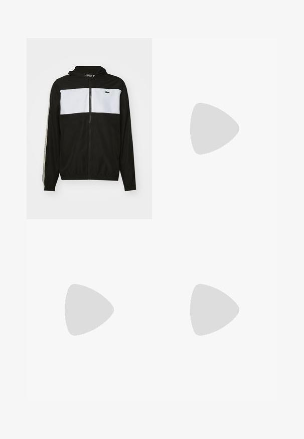 Zwart-wit zip-up jack met capuchon, voorzien van een horizontale witte panel, elastische manchetten en het Lacoste-logo op de linkerkant van de borst.; Zwart katoenen t-shirt met een groene krokodilafbeelding, ronde halslijn, korte mouwen en een ruime pasvorm. Geen extra ontwerpen of patronen.; Zwarte sportshorts gemaakt van lichtgewicht stof, met een elastische tailleband en een klein groen logo op het onderbeen aan de linkerkant.; Zwarte sportieve schoenen met een bovenwerk van mesh, zilveren accenten, getextureerde panelen en een gevoerde zool. Voorzien van veters en een logo aan de zijkant.