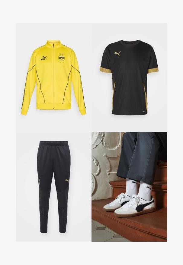 Gelbe Sportjacke mit vollem Reißverschluss, schwarzem Puma-Logo, dem Text "KING" und dem Wappen des Fußballvereins BVB 09 mit zwei Sternen auf der Brust.; Schwarzes Sport-T-Shirt mit goldenen Akzenten an denÄrmeln und an der Seite. Verfügt über einen Rundhalsausschnitt, kurze Ärmel und feuchtigkeitsableitendes DRYCELL-Gewebe.; Schwarze Sporthosen aus strukturiertem Stoff, mit elastischem Bund, goldenen Logos und Netzdetails an den Unterschenkeln für Belüftung.; Puma-Sneaker aus weißem und schwarzem Wildleder mit einer braunen Gummisohle. Kombiniert mit weißen Socken, die ein schwarzes Logo zeigen, getragen zu dunklen Hosen.