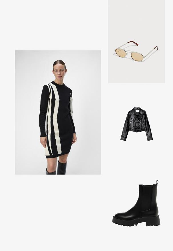 Črna usnjena motoristična jakna s krojem do pasu, z asimetričnim sprednjim zadrgo, sponkami in štirimi zadrgami. Ima nastavljiv pas na v pasu.; Pletena obleka v črni in kremni barvi z navpičnimi črtastimi vzorci. Ima okroglo izrez in dolge rokave, izdelana je iz mehkega materiala.; Črne usnjene gležnjarje z teksturirano bočno ploščo, zaobljenim prstom in debelim ploščatim podplatom, ki ima cik-cak vzorec.; Metalne sončna očala z ovalnimi, svetlo rjavimi lečami. Tanjša srebrna okvirja s teksturiranimi detajli in rdečkasto-rjavimi konicami na ročajih.
