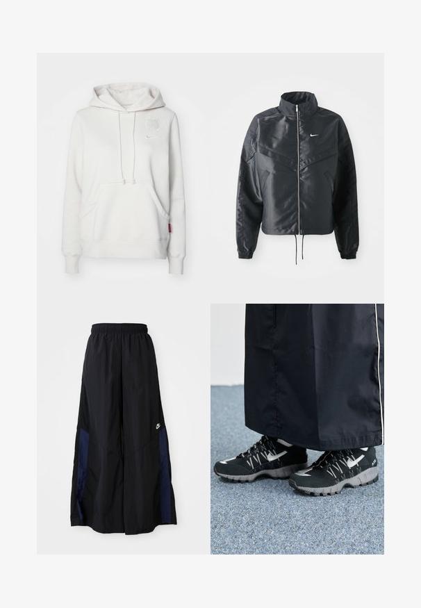 Veste noire courte avec col haut, fermeture éclair, poignets en élasthanne et logo Nike blanc. Tissu lisse et brillant avec une surface légèrement texturée.; Haut à capuche blanc avec une poche avant, une capuche à cordon, un logo en relief et une étiquette rose. Texture douce, coupe décontractée et poignets côtelés.; Pantalons larges noirs en tissu léger, avec un panneau latéral bleu marine et une taille élastique. Petit logo blanc en bas.; Des chaussures de sport noires avec un dessus texturé, des accents argentés et une semelle extérieure à motifs, associées à un long vêtement noir. Présentées sur un tapis bleu.