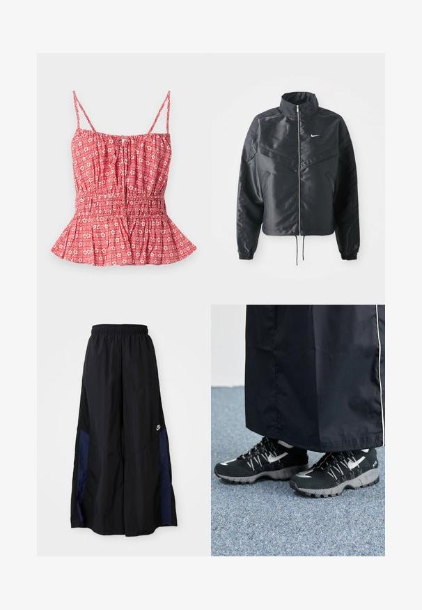 Veste noire courte avec col haut, fermeture éclair, poignets en élasthanne et logo Nike blanc. Tissu lisse et brillant avec une surface légèrement texturée.; Haut rouge à motif avec des fines bretelles, présentant un buste froncé et un ourlet en peplum. Motif floral et rayé sur un tissu léger.; Pantalons larges noirs en tissu léger, avec un panneau latéral bleu marine et une taille élastique. Petit logo blanc en bas.; Des chaussures de sport noires avec un dessus texturé, des accents argentés et une semelle extérieure à motifs, associées à un long vêtement noir. Présentées sur un tapis bleu.
