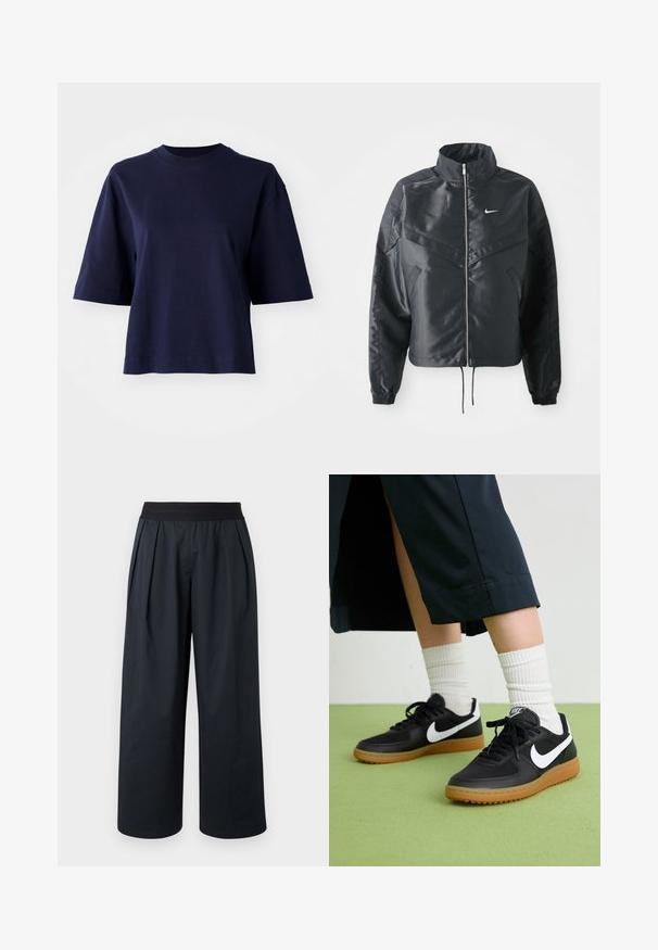 Zwarte cropped jack met hoge kraag, ritsluiting, elastische manchetten en een wit Nike-logo. Glad, glanzend materiaal met een licht gestructureerd oppervlak.; Marineblauwe katoenen t-shirt met een ronde hals, korte mouwen en een relaxte pasvorm. Beschikt over een effen kleur zonder patronen of versieringen.; Zwarte broek met wijde pijpen, geplooide voorkant, elastische tailleband en gladde stoftextuur. Voorzien van een losse pasvorm en cropped lengte.; Zwarte leren en synthetische sneakers met witte Nike swoosh, rubberen gumzool, ronde neus en zwarte veters. Geribbelde witte sokken zichtbaar.