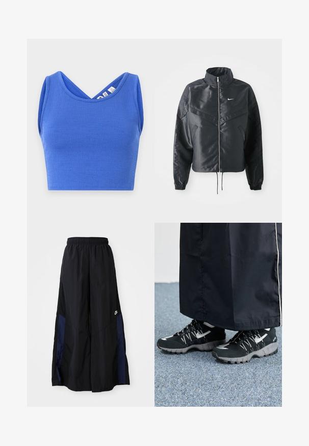 Schwarze, verkürzte Jacke mit hohem Kragen, Reißverschluss, Elastan-Ärmeln und einem weißen Nike-Logo. Glattes, glänzendes Material mit leicht strukturiertem Oberflächeneffekt.; Blaues, kurzes Tanktop aus strukturiertem Material. Verfügt über ein V-Ausschnitt-Design und ärmellosen Schnitt mit einer taillierten Silhouette.; Schwarze weit geschnittene Hose aus leichtem Stoff, mit einem dunkelblauen Seitenpanel und einem elastischen Bund. Kleines weißes Logo am unteren Ende.; Schwarze Sportschuhe mit einer strukturierten Oberseite, silbernen Akzenten und einer gemusterten Außensohle, kombiniert mit einem schwarzen langen Kleidungsstück. Auf einem blauen Teppich drapiert.