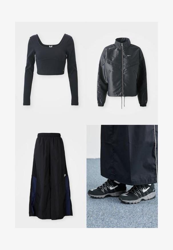Giacca nera cropped con colletto alto, chiusura a zip, polsini in elastan e logo Nike bianco. Tessuto liscio e lucido con una superficie leggermente texturizzata.; Top cropped nero a maniche lunghe in tessuto ribbed, con ampia scollatura a girocollo e silhouette aderente, con un sottile accento del logo del marchio.; Pantaloni neri a gamba larga realizzati in tessuto leggero, con un pannello laterale blu navy e una cintura elastica. Piccolo logo bianco sul fondo.; Scarpe sportive nere con tomaia testurizzata, dettagli argentati e suola con motivo, abbinate a un lungo indumento nero. Ambientate su un tappeto blu.