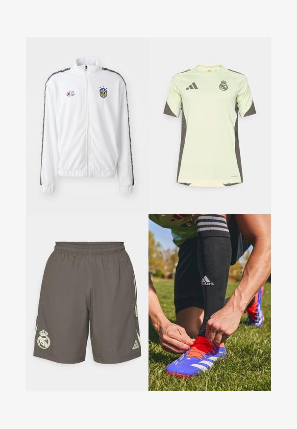 Witte zip-up jas met opstaande kraag, voorzien van een blauw en rood geborduurd logo, en gestreepte zwarte patronen op de mouwen. Glad textuur.; Lichtgroen t-shirt met korte mouwen en donkergrijze accenten, voorzien van het teamlogo op de borst, gemaakt van ademend materiaal met vochtafvoerende technologie.; Grijze sportshorts met een elastische tailleband, lichtgroene zijstrepen en een wit Real Madrid-logo op de linkerpunt.; Blauwe en oranje voetbalschoenen met witte strepen, die door een hand worden vastgebonden. Zwarte sokken met strepen zichtbaar boven de enkel. Groene grasachtergrond.