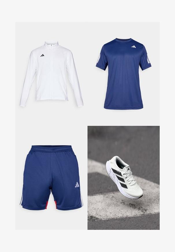 Biała sportowa kurtka z długimi rękawami, wysokim kołnierzem i pełnym zamkiem błyskawicznym. Posiada czarną logo z trzema paskami po lewej stronie u góry.; Granatowa koszulka sportowa z krótkim rękawem, wykonana z gładkiego materiału, z okrągłym dekoltem i białym logo na lewej górnej stronie klatki piersiowej.; Granatowe szorty sportowe z białymi i czerwonymi akcentami, z elastycznym pasem i logo Adidas po dolnej stronie. Gładka faktura materiału.; Białe buty sportowe z teksturowaną siateczką, czarnymi paskami, z zapięciem na sznurowadła i wyściełaną podeszwą, unoszące się nad oznaczoną nawierzchnią drogi.