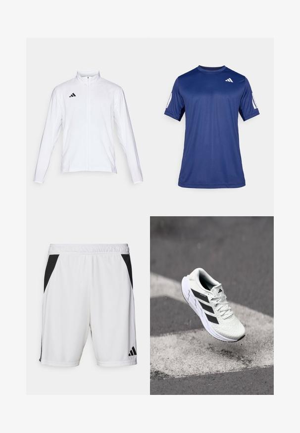 Bela atletska jakna z dolgimi rokavi, visokim ovratnikom in popolnim zadrgo. Ima črn logotip s tremi črtami na zgornji levi strani.; Mornarsko modra kratka športna majica iz gladkega materiala, s krožnim ovratnikom in belim logotipom na zgornjem levem prsnem delu.; Bele športne kratke hlače bele barve z črnim stranskim panelom, elastičnim pasom in logotipom Adidas na spodnjem desnem delu noge. Narejene so iz lahkega materiala.; Bela atletska čevlja z teksturiranim mrežastim zgornjim delom, črnimi črtami, zavezovanjem na vezalke in oblazinjenim podplatom, lebdi nad označeno cesto.