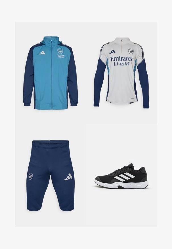 Lahka nepremočljiva jakna z teal sprednjim delom in mornarskimi rokavi, ki ima zadrgo, kapuco in logotipne poudarke na prsih.; Bela dolga majica s kratkimi rokavi z mornarsko modrimi detajli, polovična zadrga pri vratu, ki vsebuje logotip "Emirates Fly Better" in grb kluba Arsenal.; Morske atletske kratke hlače, narejene iz raztegljive tkanine, z logotipom Arsenala na levi nogi in tremi belimi Adidasovimi črtami na desni nogi.; Črne atletske čevlje z strukturiranim mrežastim zgornjim delom, belimi poudarnimi črtami, oblazinjenim podplatom in ojačanim petnim delom za podporo.
