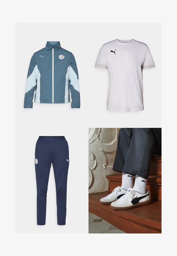 Vēja pārtraucējs jaka tumši zaļā un gaiši zilā krāsā, ar priekšējo rāvējslēdzēju, augstu apkakli un Mančestras City logo uz krūtīm.; Balta īsām piedurknēm sporta krekls ar apaļu kakla izgriezumu, ar elpojošiem acs akcentiem sānos un melnu Puma logotipu krūtīs.; Jūras spēku sporta bikses, kas izgatavotas no elpojoša auduma, ar pieguļošu dizainu, elastīgu jostasvietu un baltām logo akcentiem uz augšstilba.; Puma kedas baltā un melnā zamšā, ar brūnu gumijas zoli. Pāris ar baltām zeķēm, kurās redzams melns logo, nēsātas ar tumšām biksēm.