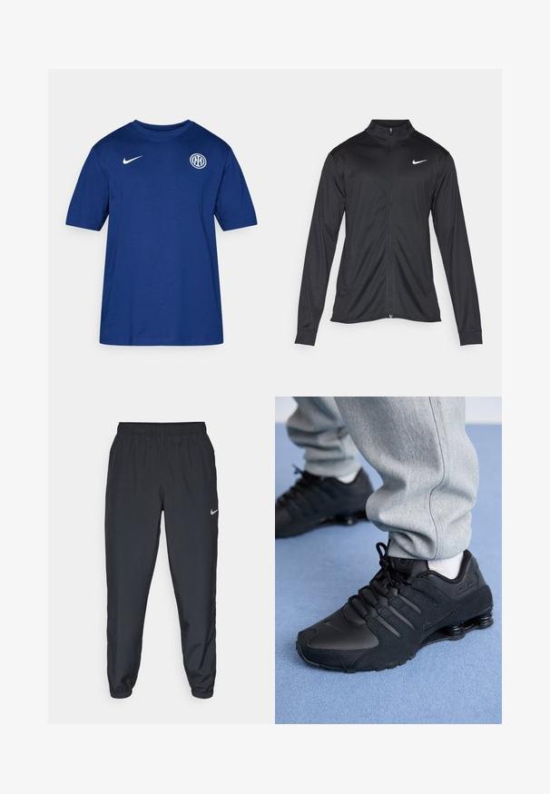 Čierna športová bunda s dlhými rukávmi, golierom a plným zipsom. Obsahuje nenápadné logo Nike v bielej farbe na hornej ľavej hrudi. Hladká textúra.; Modrá bavlnená tričko s krátkym rukávom a okrúhlym výstrihom, so bielym logom Nike na pleci a okrúhlym emblémom klubu na hrudi.; Čierne teplákové nohavice vyrobené z ľahkého materiálu s elastickým pásom, manžetami na členkoch a diskrétnym logom Nike na ľavej strane.; Osoba v čiernych teniskách Nike Shox a šedých teplákoch stojí na svetlomodrom koberci.