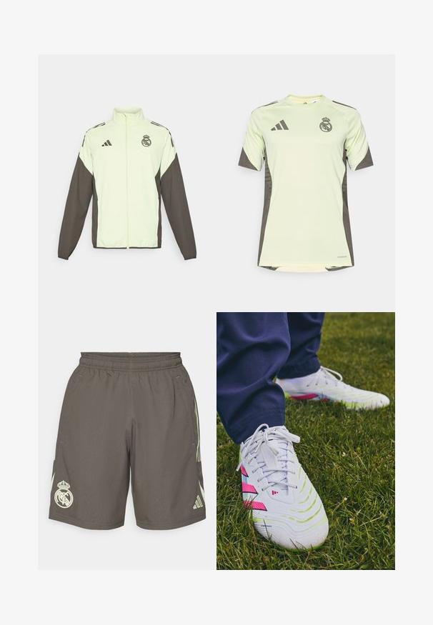 Adidas jack met een lichtgroene body en donkerbruine mouwen. Voorzien van een hoge kraag, een ritssluiting aan de voorkant en een logo op de borst.; Lichtgroen t-shirt met korte mouwen en donkergrijze accenten, voorzien van het teamlogo op de borst, gemaakt van ademend materiaal met vochtafvoerende technologie.; Grijze sportshorts met een elastische tailleband, lichtgroene zijstrepen en een wit Real Madrid-logo op de linkerpunt.; Witte sportieve schoenen met gestructureerde oppervlakken, groene en roze accenten, en een onderscheidend zoolpatroon, gezet tegen gras.