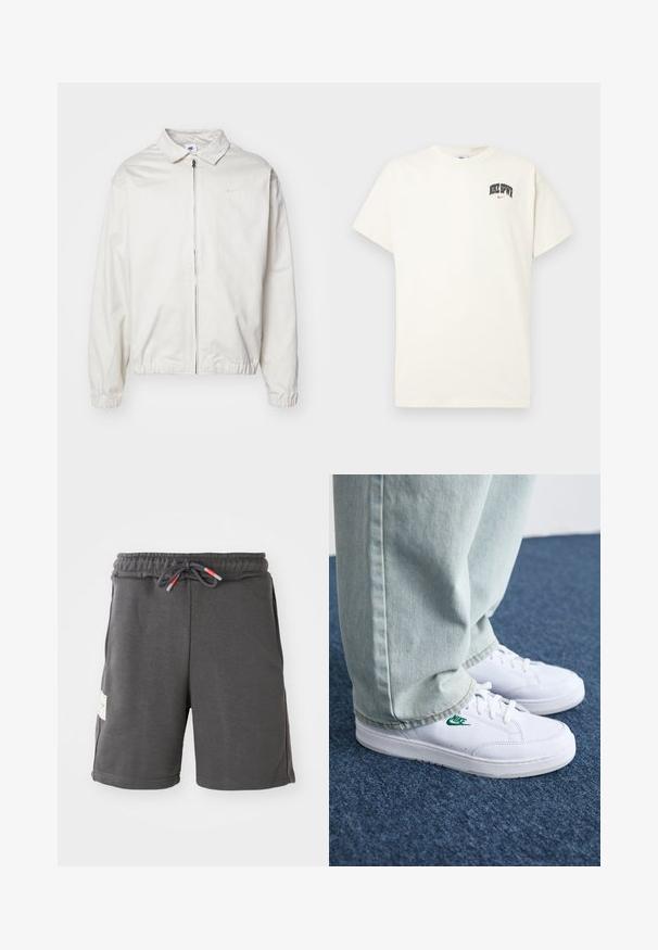 Casaco Nike branco e leve, com gola, fecho frontal, punhos elásticos e um pequeno logótipo no lado esquerdo do peito. Textura suave.; T-shirt de algodão na cor creme com mangas curtas, apresentando "NIKE SB" em texto preto e vermelho no peito. Gola redonda padrão.; Calções atléticos cinzentos com um cós elástico e cordão. Apresenta bolsos laterais e uma etiqueta de tecido do lado esquerdo. Material leve.; Tênis de couro brancos com logo verde da Nike, bico redondo, sola plana, combinados com calças de denim azul claro, exibidos sobre um tapete azul.