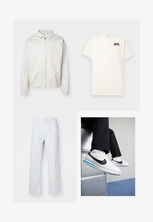 Witte, lichte Nike-jack met een kraag, een rits aan de voorkant, elastische manchetten en een klein logo op de linkerkant van de borst. Glad oppervlak.; Crème-kleurige katoenen T-shirt met korte mouwen, voorzien van "NIKE SB" in zwarte en rode tekst op de borst. Standaard ronde halslijn.; Lichtgrijze wijde broek gemaakt van een katoenmix. Bevat twee voorzakken, zichtbare naden en accenten van goudkleurige knopen.; Witte leren sneakers met een zwarte Nike swoosh, lichtblauwe en grijze rubberen zool, en een klassiek vetersluiting ontwerp. Voeten rustend op een archiefkast.