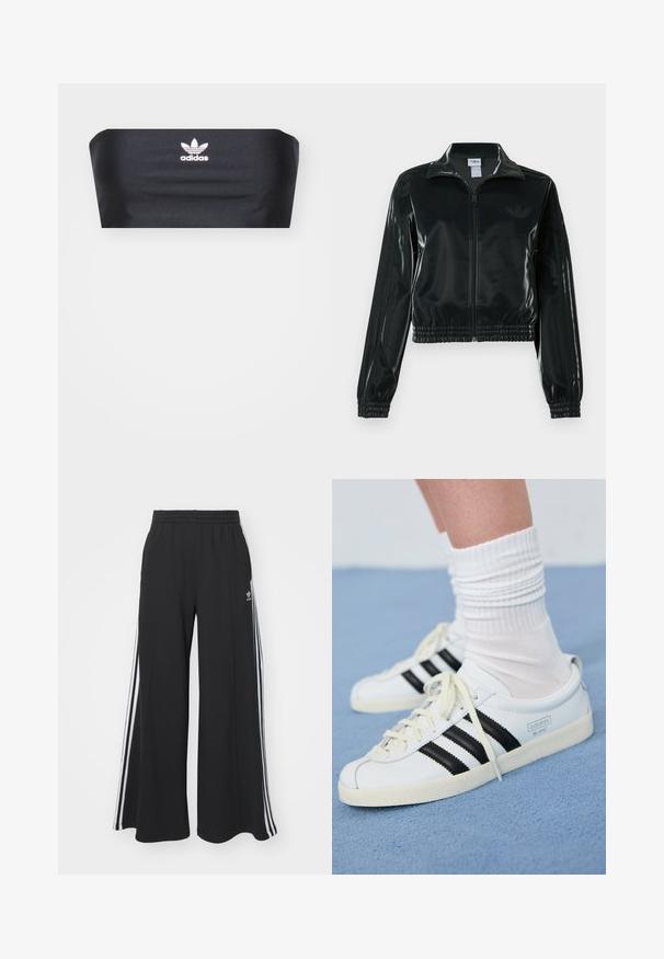 Casaco curto preto brilhante com fecho de correr frontal, gola alta e bainha elástica. Apresenta três riscas nas mangas e um pequeno logotipo no peito.; Top bandeau preto feito de tecido suave, com um logotipo branco da Adidas centrado na frente, sem padrões ou ornamentos adicionais.; Calças de suor largas e pretas com uma cintura elástica, apresentando riscas brancas nas laterais e um logótipo bordado na coxa esquerda.; Tenis brancos de couro com riscas pretas, sola em creme e atacadores claros. Usados com meias brancas com nervuras, posicionados sobre um fundo azul.