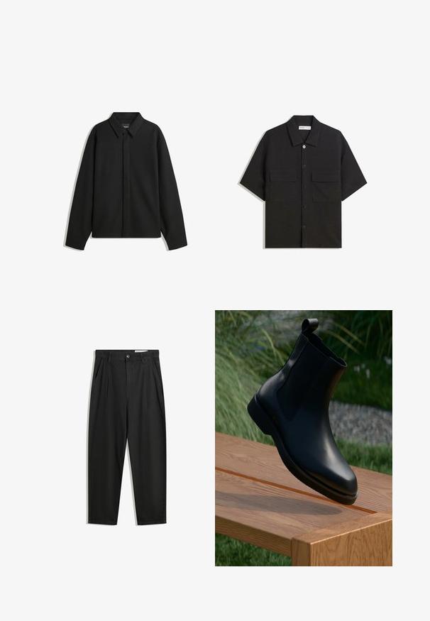 Crna jakna s dugim rukavima i oštrim ovratnikom, prednjim kopčanjem i glatkom teksturom. Opušteni kroj s spuštenim ramenima.; Crna kratka majica s kratkim rukavima, izrađena od tkanine glatke teksture, sadrži dvije prednje džepove, klasičnu kragnu i kopčanje na gumbe.; Crne pamučne hlače s opuštenim krojem, s klasičnim pojasom, prednjim nabranjima i bočnim džepovima. Glatka tekstura bez uzoraka.; Crne kožne gležnjače s glatkom završnom obradom, elastičnim bočnim panelima i ručkom na dršci, postavljene na drvenoj površini.